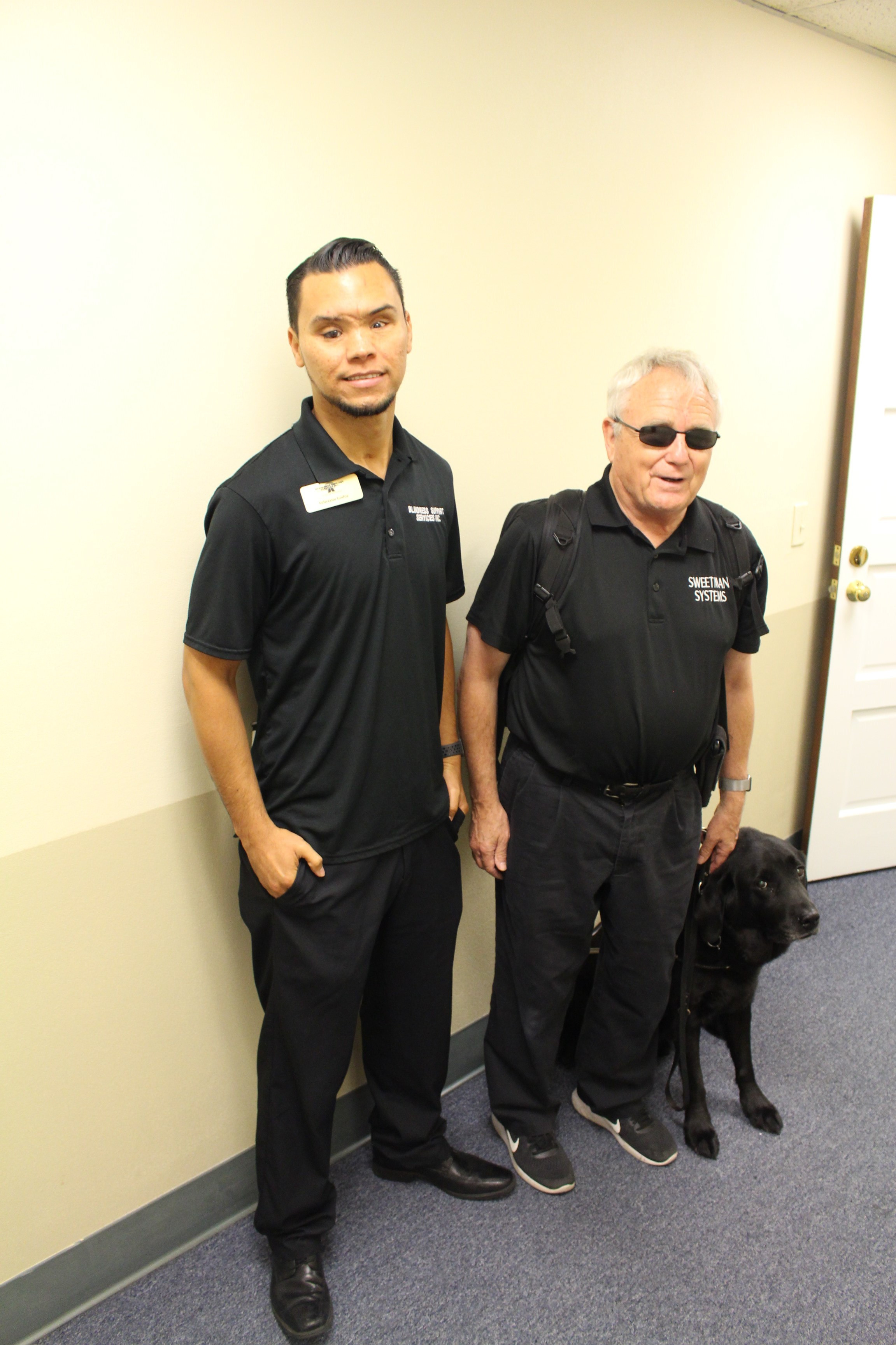 Feliciano, Assistive technology specialist, and Bob Sweetman standing side by side