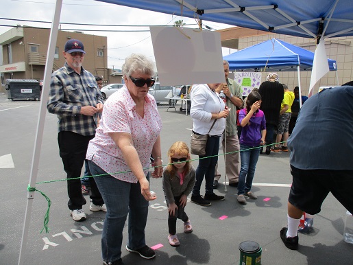 people enjoying the ring toss booth