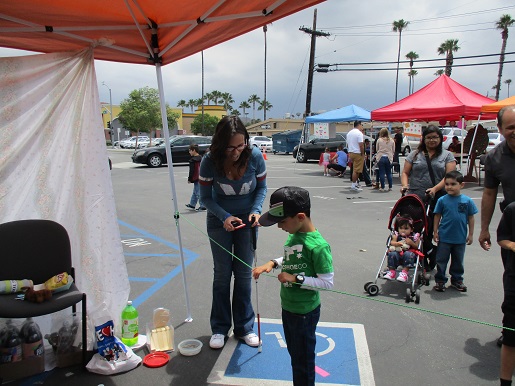 a little boy at the ring toss