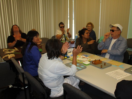 Everyone is having fun putting together Braille puzzle fragments of complete sentences