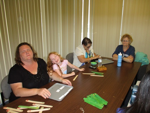 The whole family is here having fun at Braille Game Day