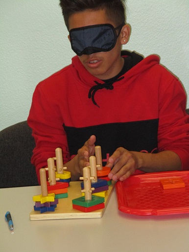 Here is a child completing the task after being blindfolded.
