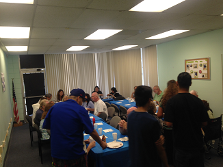 Everyone eating breakfast at the fundraiser