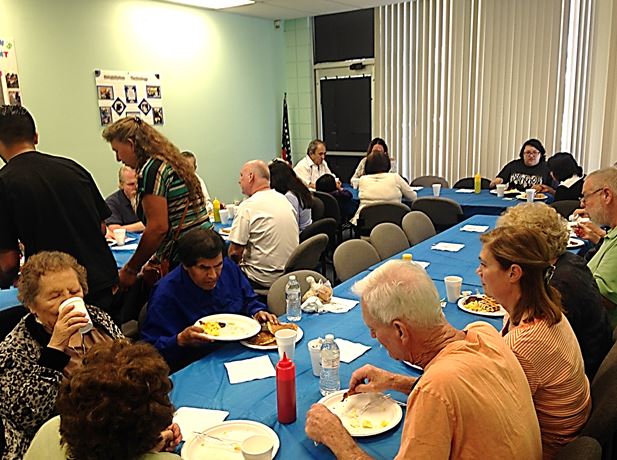 everyone eating breakfast in the pancake room.