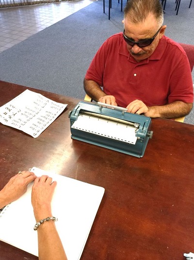 Sal typing Braille in Braille class.