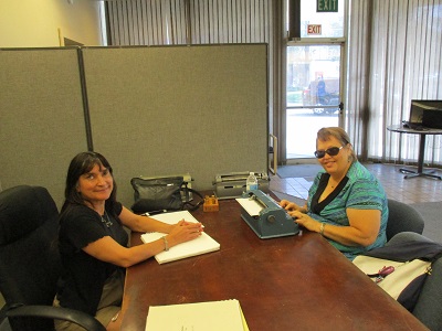 Christine is teaching Braille to Teresa Mealer.