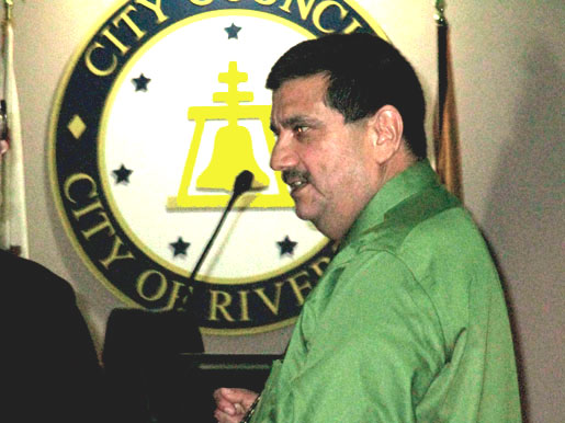 Pete standing under the crest of Riverside City Hall