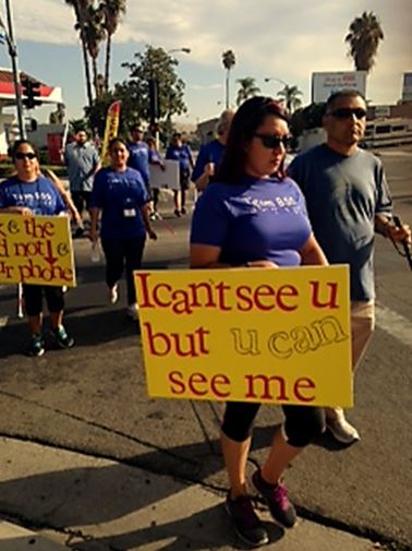 Taking it to the streets with our white canes and signs