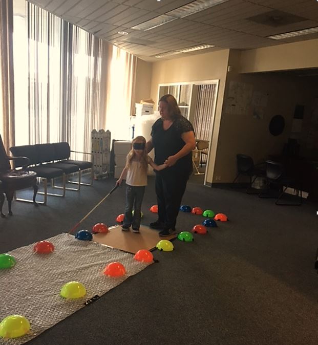 a parent and child navigate one of the mazes