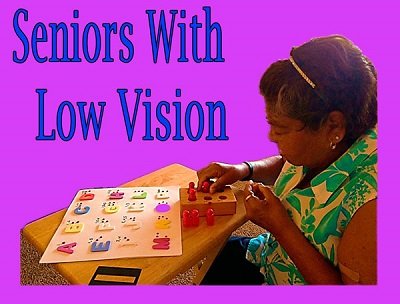 seniors with low vision learning with Braille teaching props.