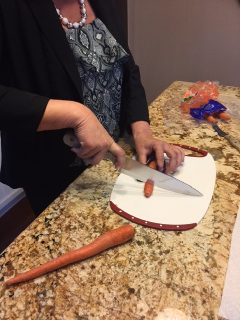 Learning safe ways to chop vegitables.
