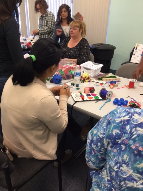 Here are school teachers putting together props for teaching their blind students.