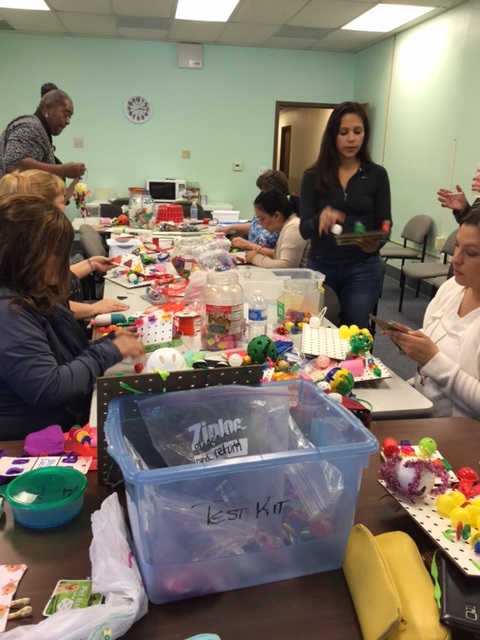 Everyone is busy making props for their blind students.