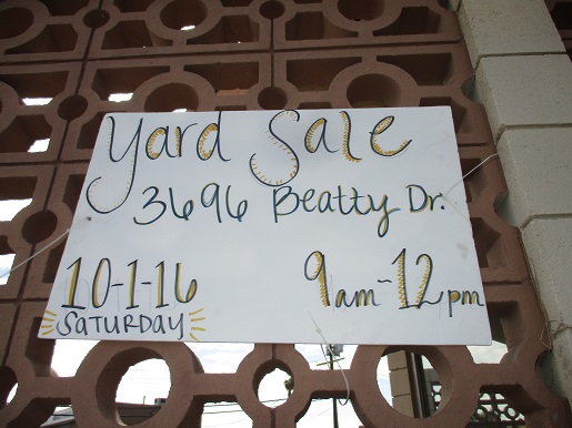 a sign that says yard sale at blindness support services on 3696 Beatty Drive